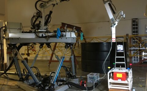 Photograph of Proteus 100 on motion platform testing camera system on model ROV in the STL workshop.