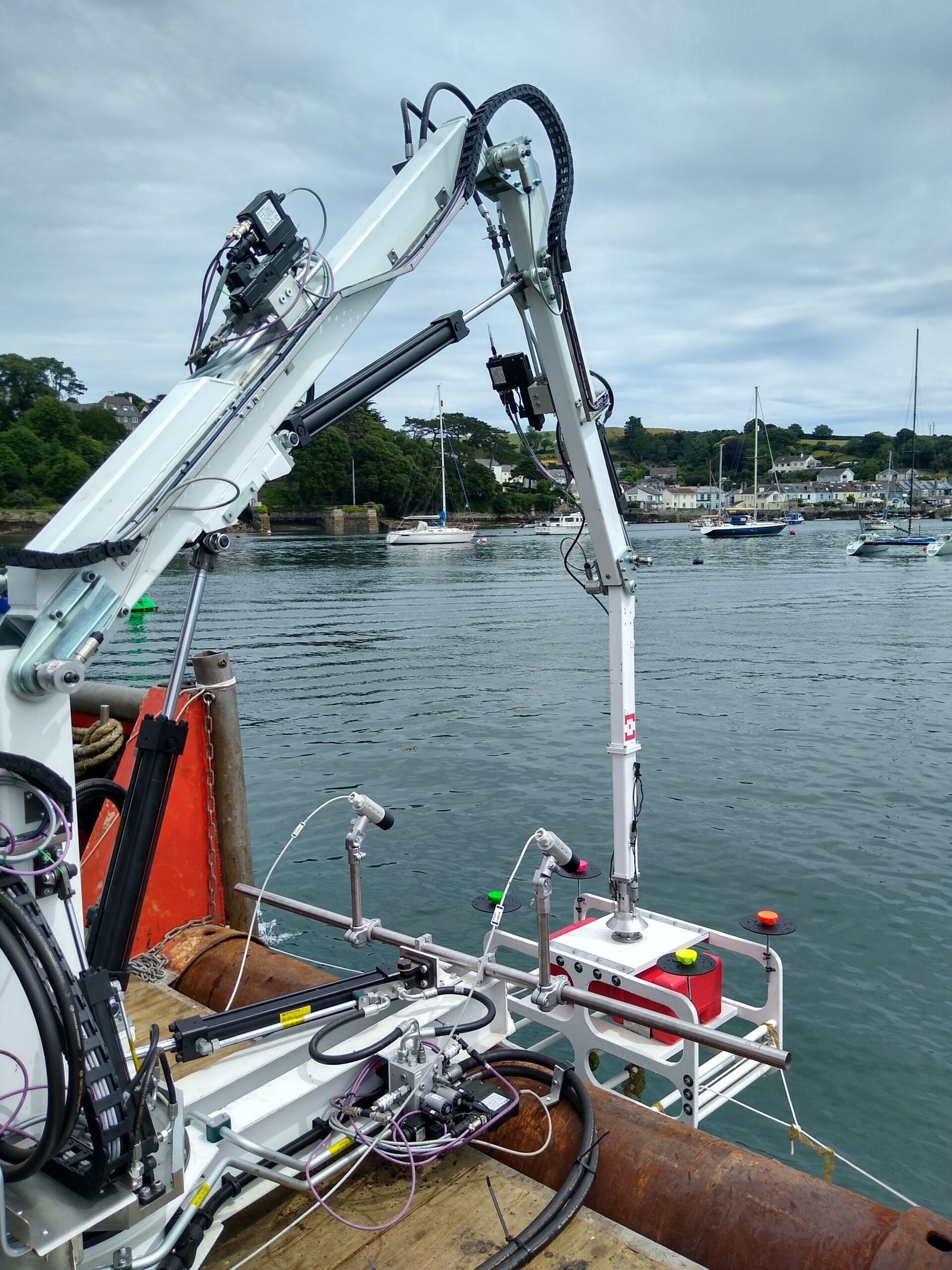Photograph of Proteus 100 on bow of vessel, lifting ROV out of the water