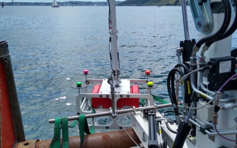 Photograph of Proteus 100 lifting model ROV out of sea